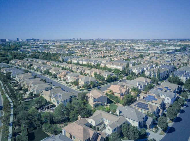 Aerial view of a residential neighborhood in Torrance featuring homes with solar panels, emphasizing the importance of solar energy solutions in the area.
