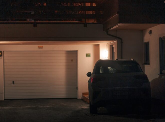 electric vehicle charging in residential garage at night